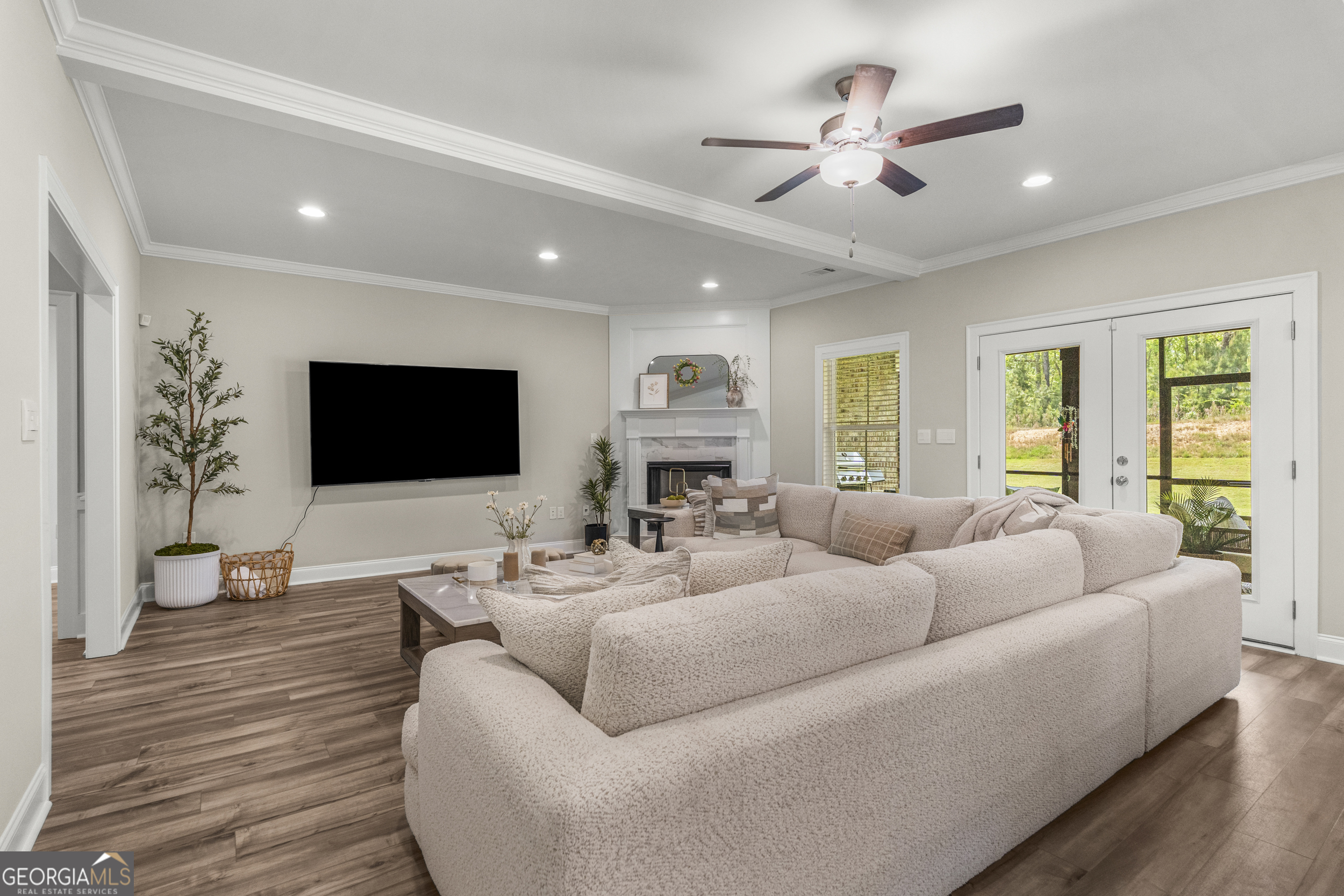 334 Orchard Drive Fortson, GA 31808 - Photo 17 of 48 a living room with furniture ceiling fan and a flat screen tv