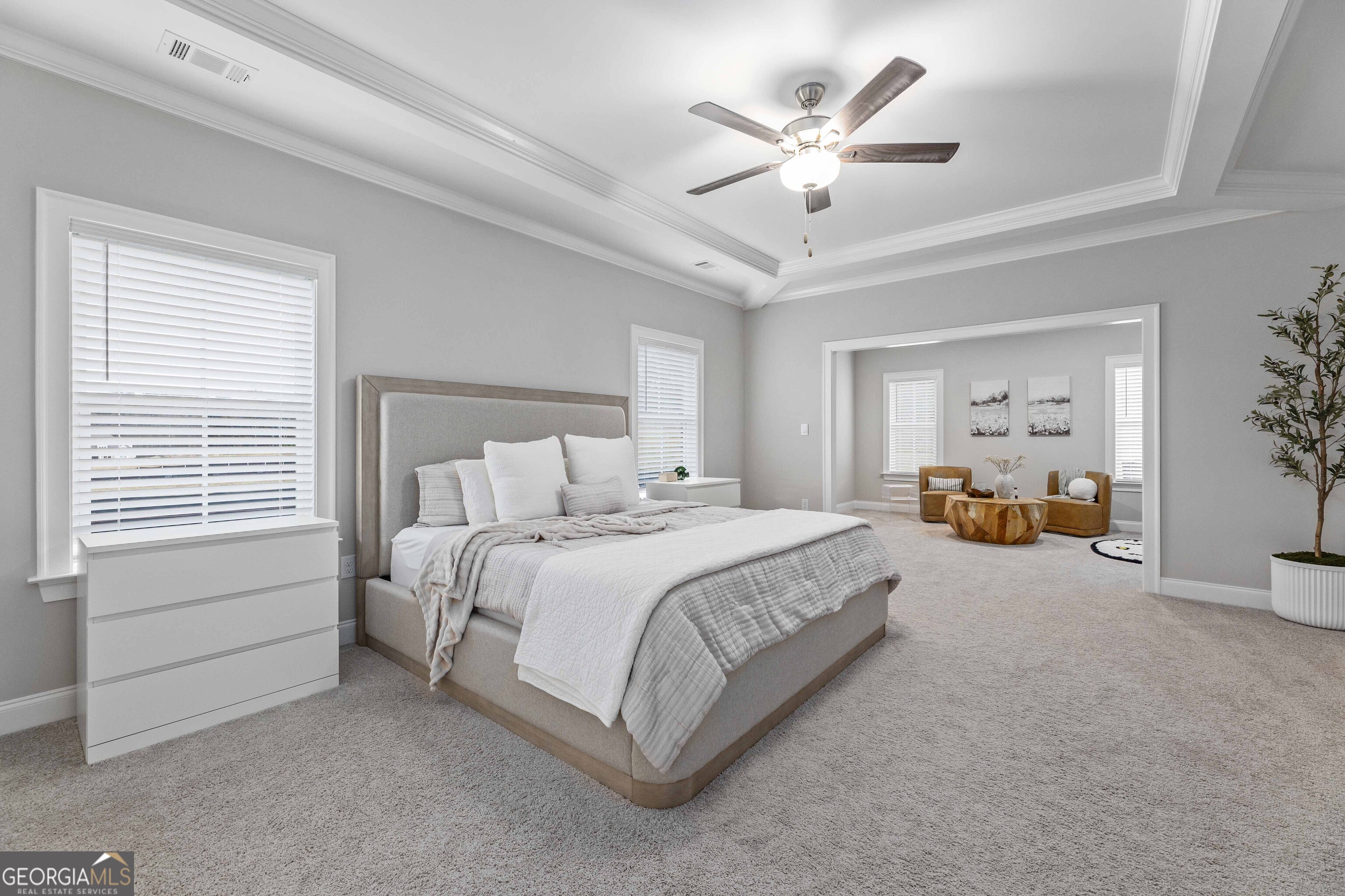 334 Orchard Drive Fortson, GA 31808 - Photo 22 of 48 a spacious bedroom with a large bed and a chandelier