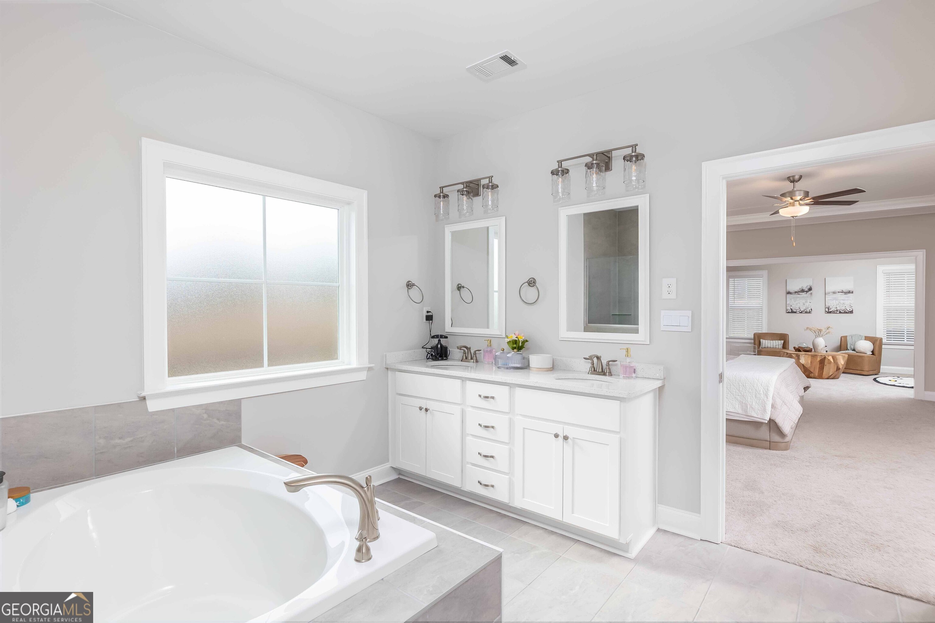 334 Orchard Drive Fortson, GA 31808 - Photo 26 of 48 a spacious bathroom with a tub sink and mirror