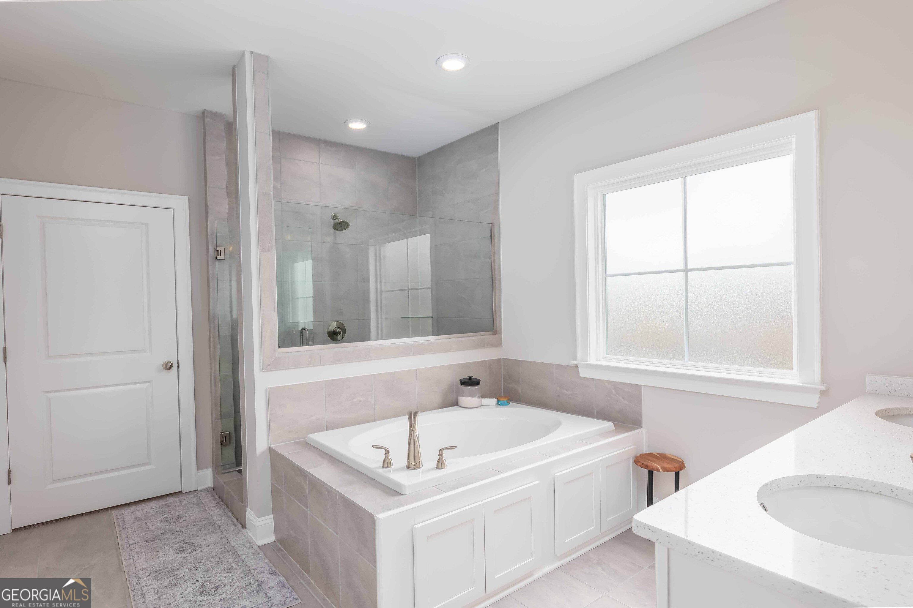 334 Orchard Drive Fortson, GA 31808 - Photo 27 of 48 a bathroom with a tub sink and mirror