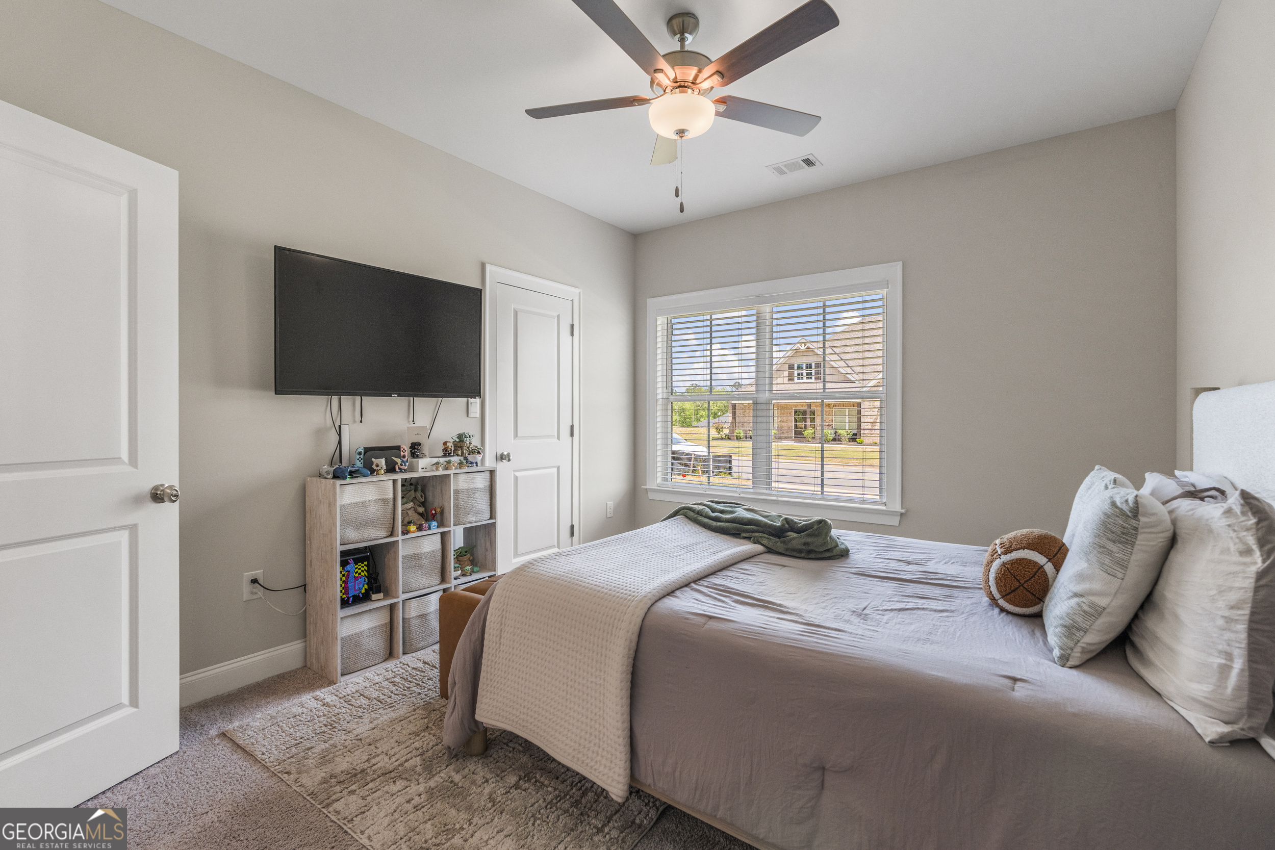334 Orchard Drive Fortson, GA 31808 - Photo 30 of 48 a bedroom with a bed and a flat screen tv