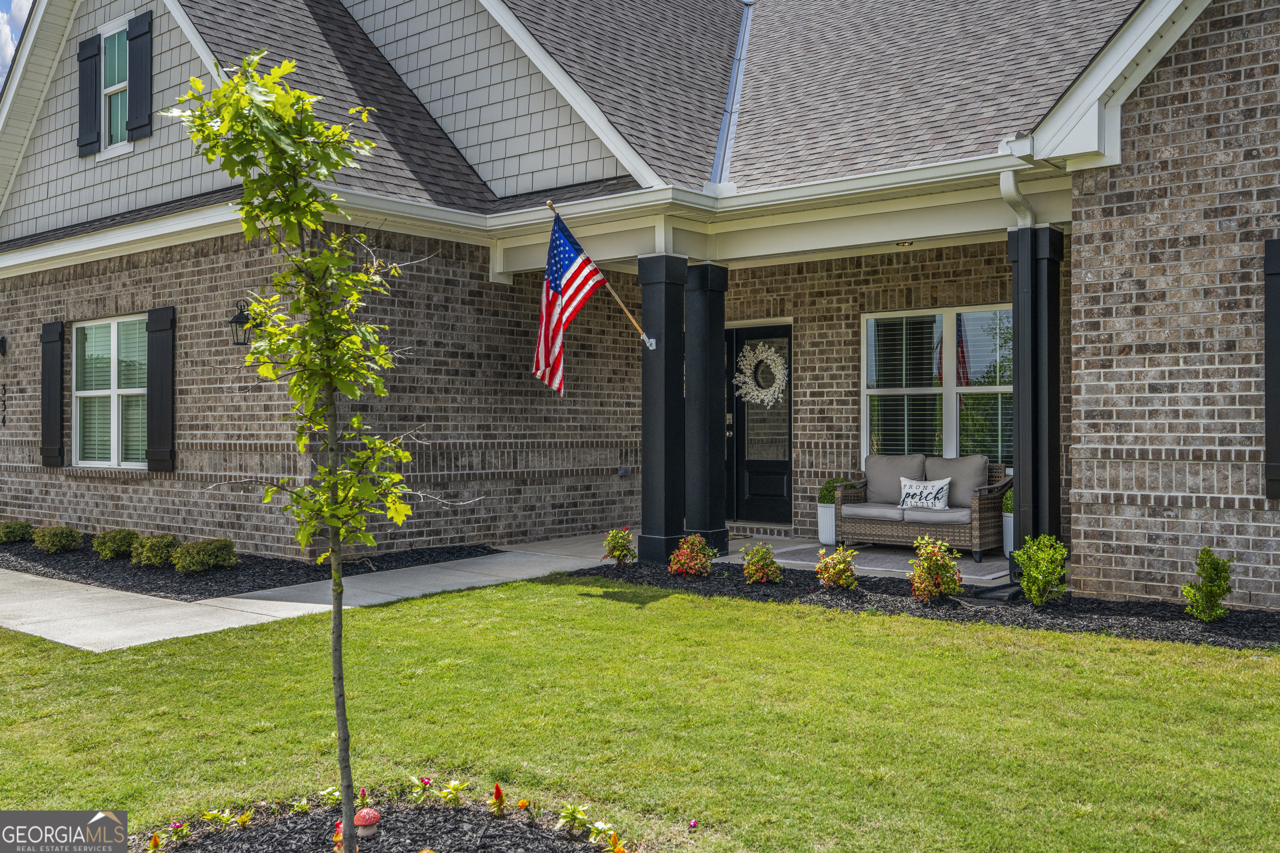334 Orchard Drive Fortson, GA 31808 - Photo 3 of 48 a front view of a house with garden