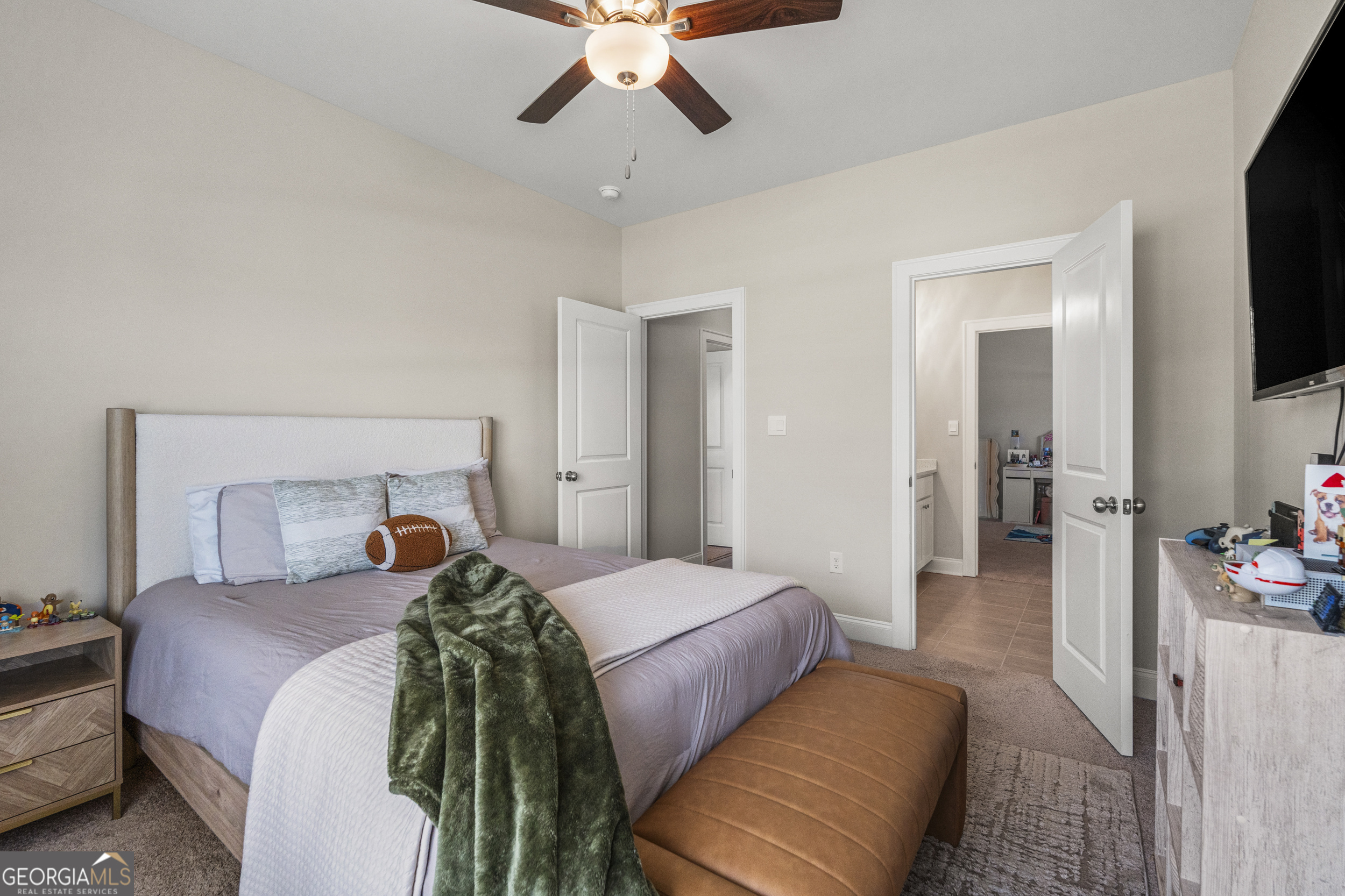 334 Orchard Drive Fortson, GA 31808 - Photo 31 of 48 a bedroom with a bed and a flat tv screen