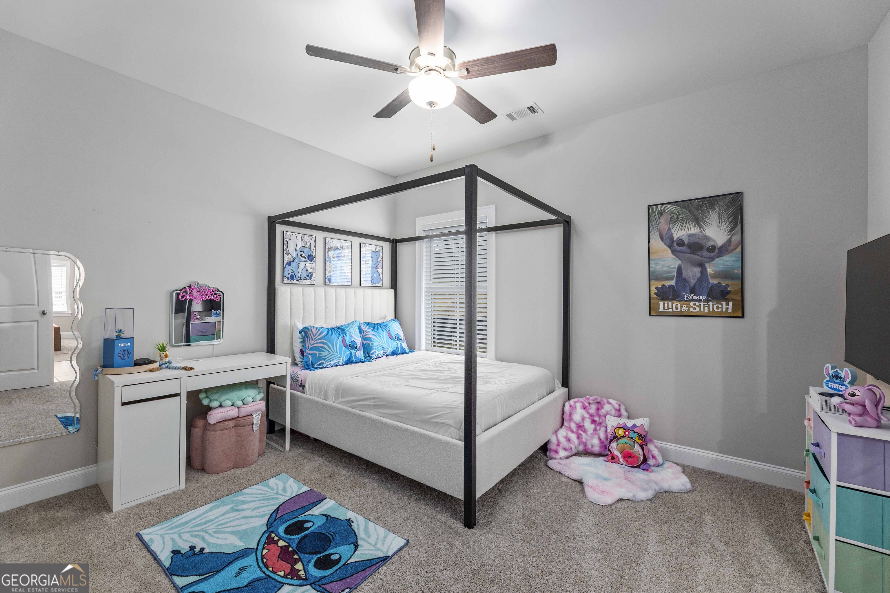 334 Orchard Drive Fortson, GA 31808 - Photo 32 of 48 a bedroom with a bed and a chandelier