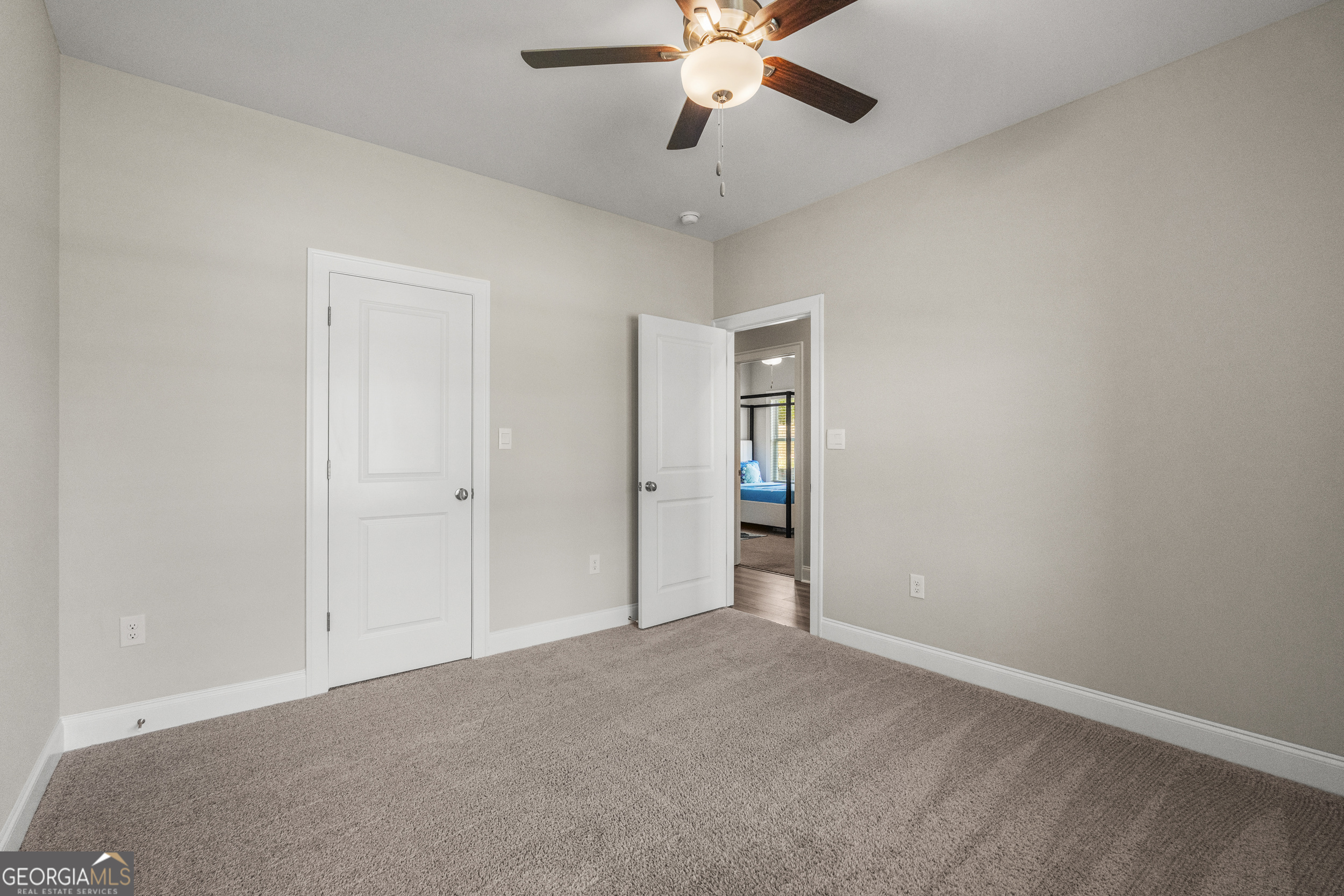 334 Orchard Drive Fortson, GA 31808 - Photo 37 of 48 a view of an empty room and a chandelier fan