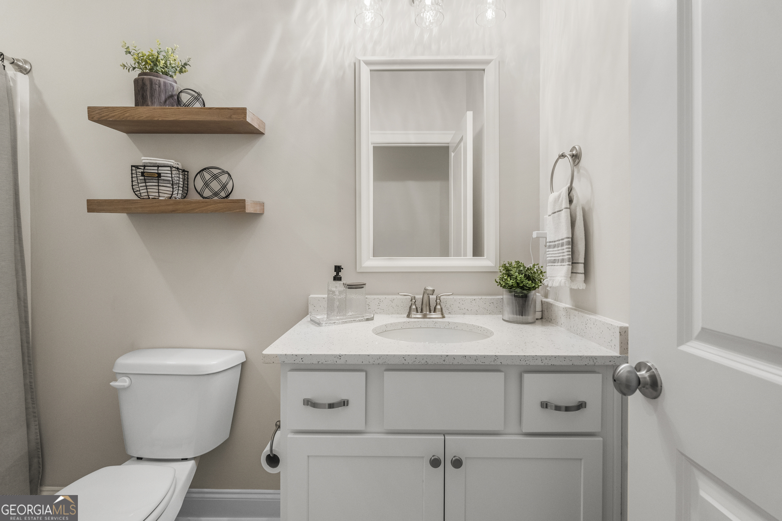 334 Orchard Drive Fortson, GA 31808 - Photo 38 of 48 a bathroom with a toilet sink and mirror
