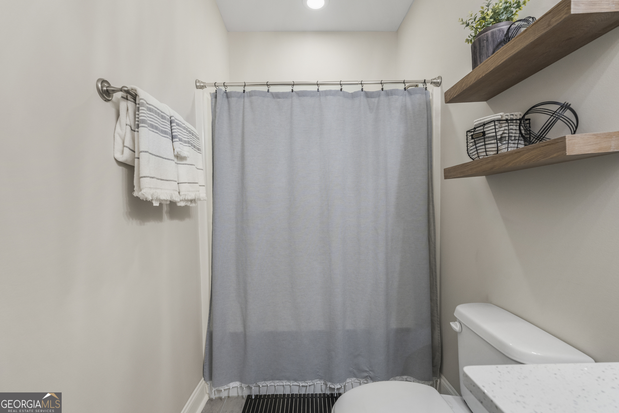 334 Orchard Drive Fortson, GA 31808 - Photo 39 of 48 a bathroom with a shower curtain and a sink