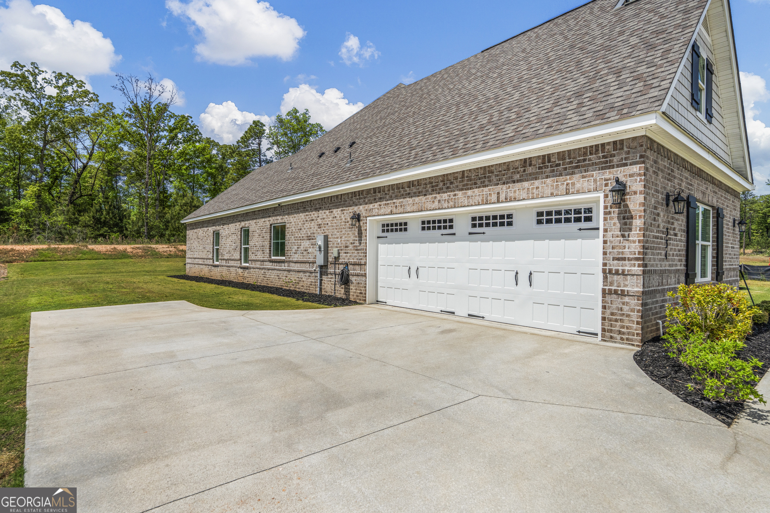 334 Orchard Drive Fortson, GA 31808 - Photo 45 of 48 a view of house with outdoor space and parking
