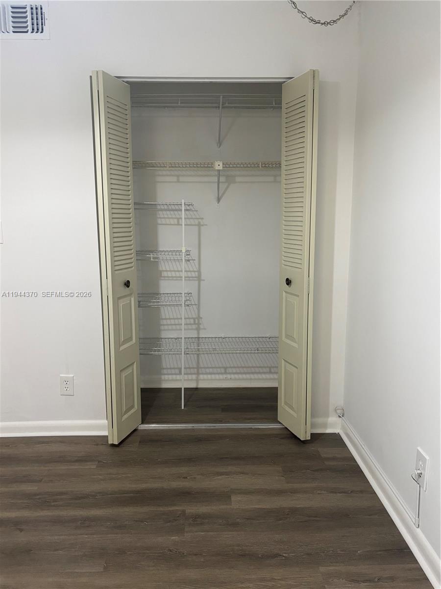 10023 Winding Lake Road, Unit 101 Sunrise, FL 33351 - Photo 13 of 19 a view of wooden door