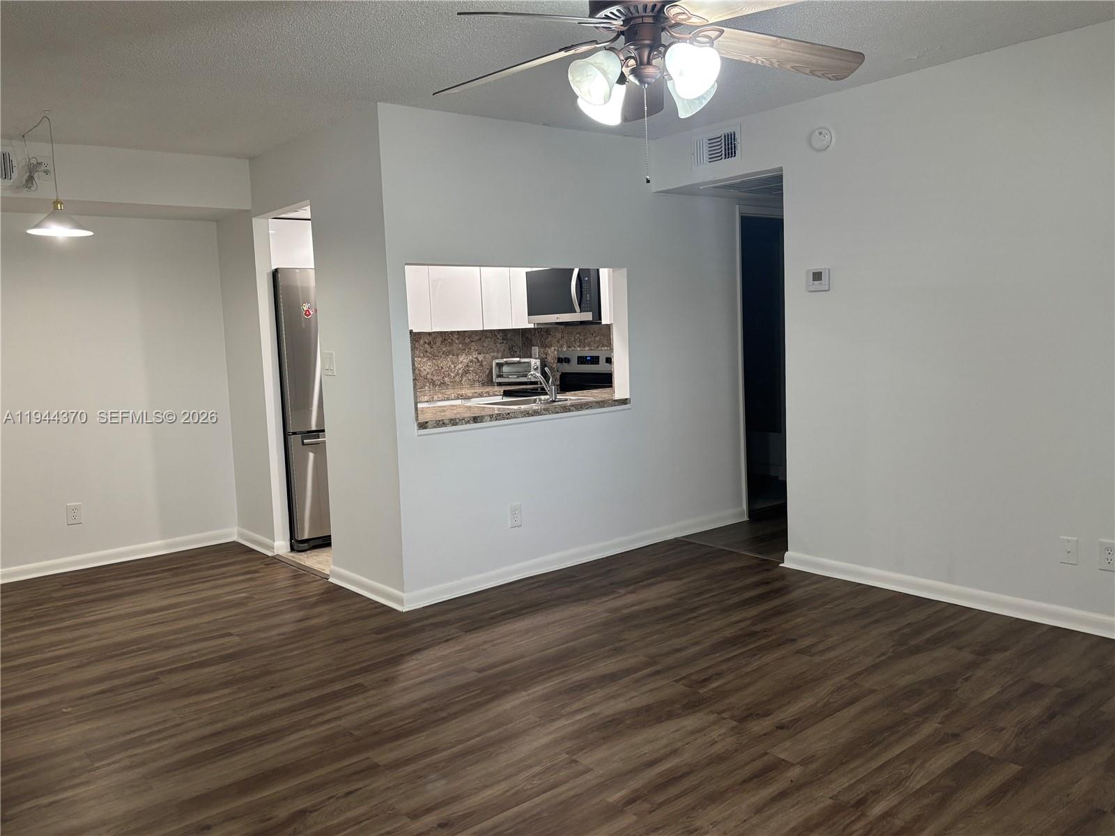 10023 Winding Lake Road, Unit 101 Sunrise, FL 33351 - Photo 6 of 19 a view of a livingroom with wooden floor