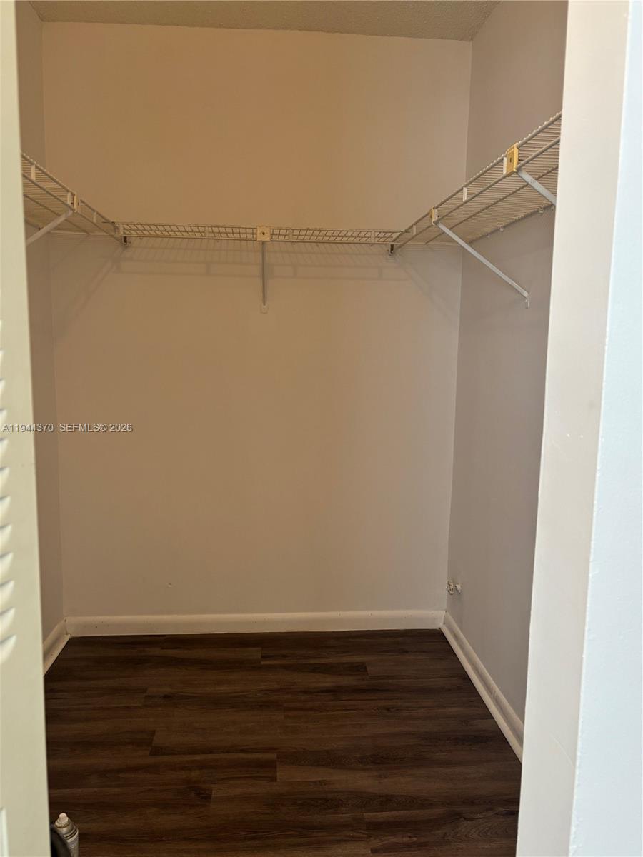 10023 Winding Lake Road, Unit 101 Sunrise, FL 33351 - Photo 9 of 19 a view of an empty walk in closet