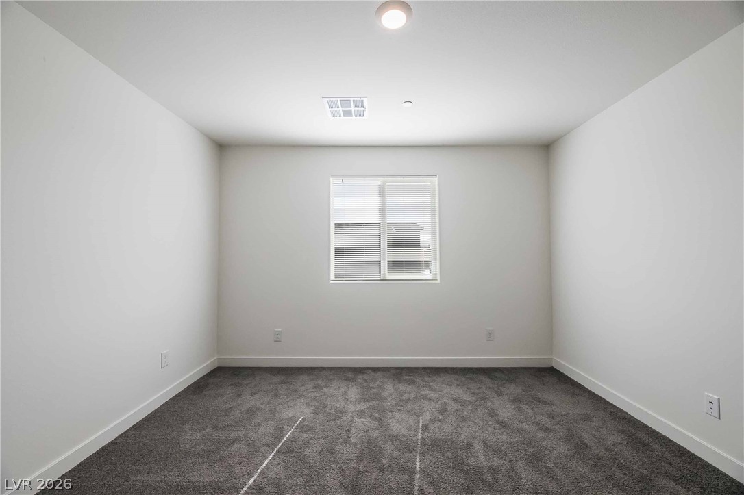 12749 Epperly Street Henderson, NV 89044 - Photo 8 of 22 A well-lit, neutral canvas ready for personalization.