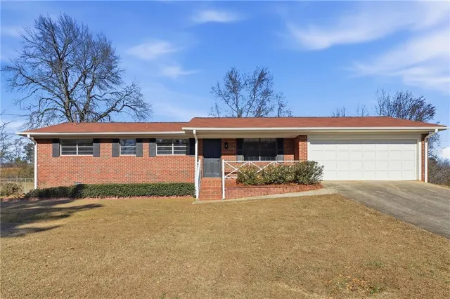 front view of a house with a garden