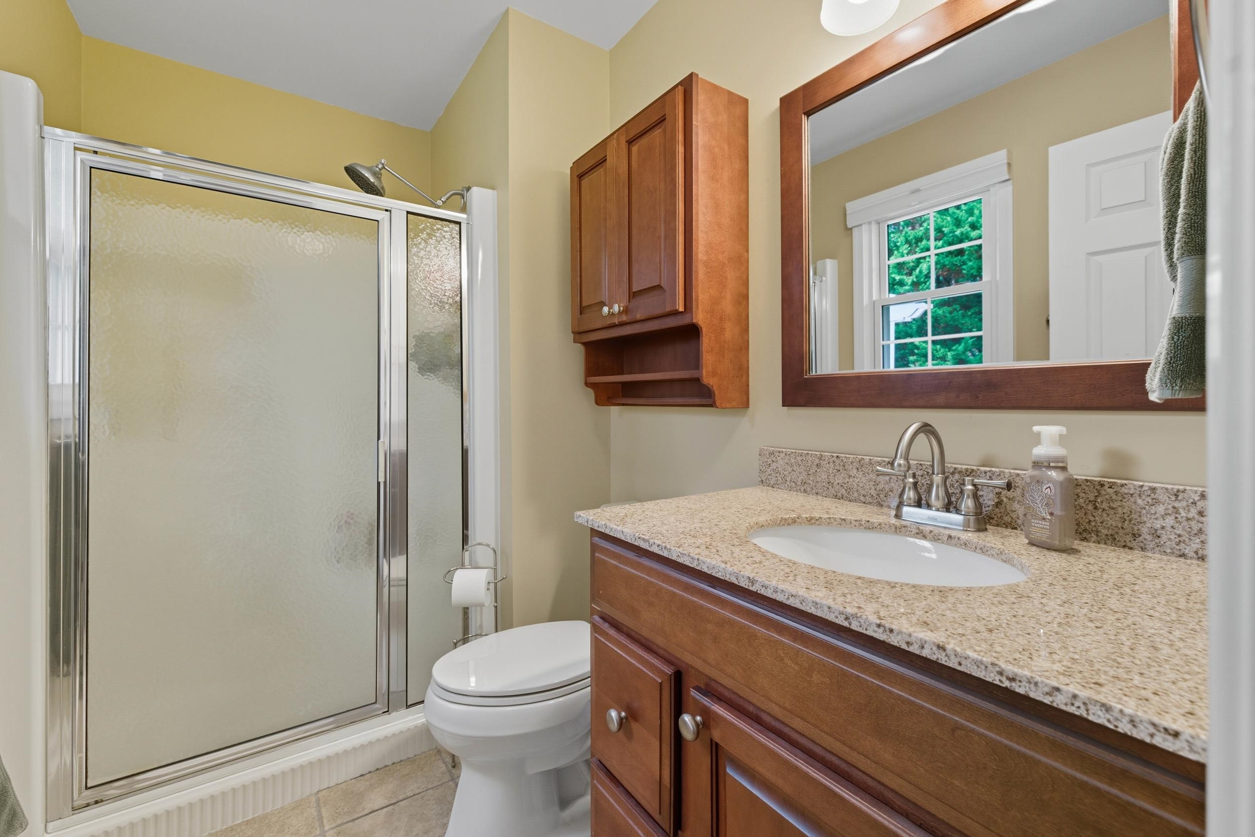 134 Rorrer Circle Harrisonburg, VA 22801 - Photo 17 of 74 a bathroom with a granite countertop sink toilet and shower