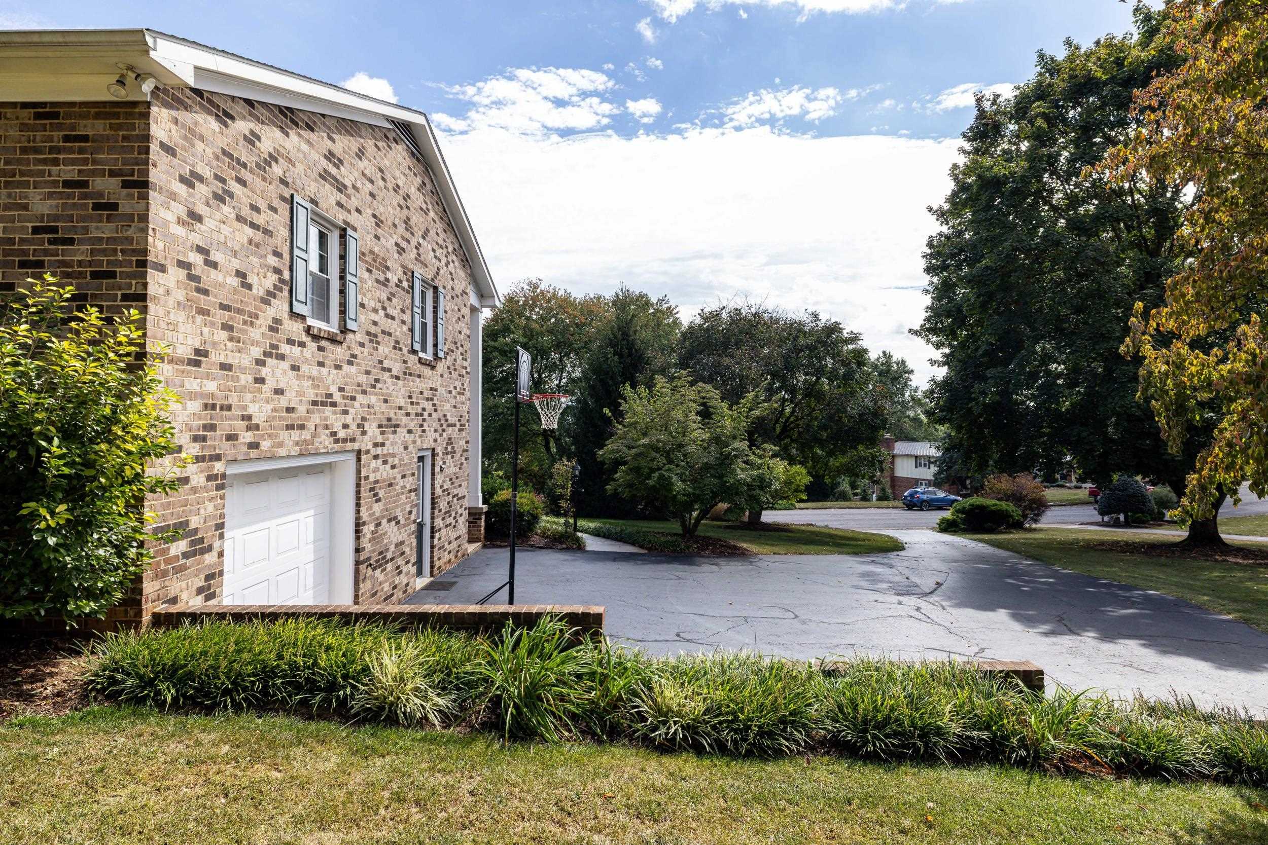 134 Rorrer Circle Harrisonburg, VA 22801 - Photo 52 of 74 a view of a backyard with potted plants and large tree