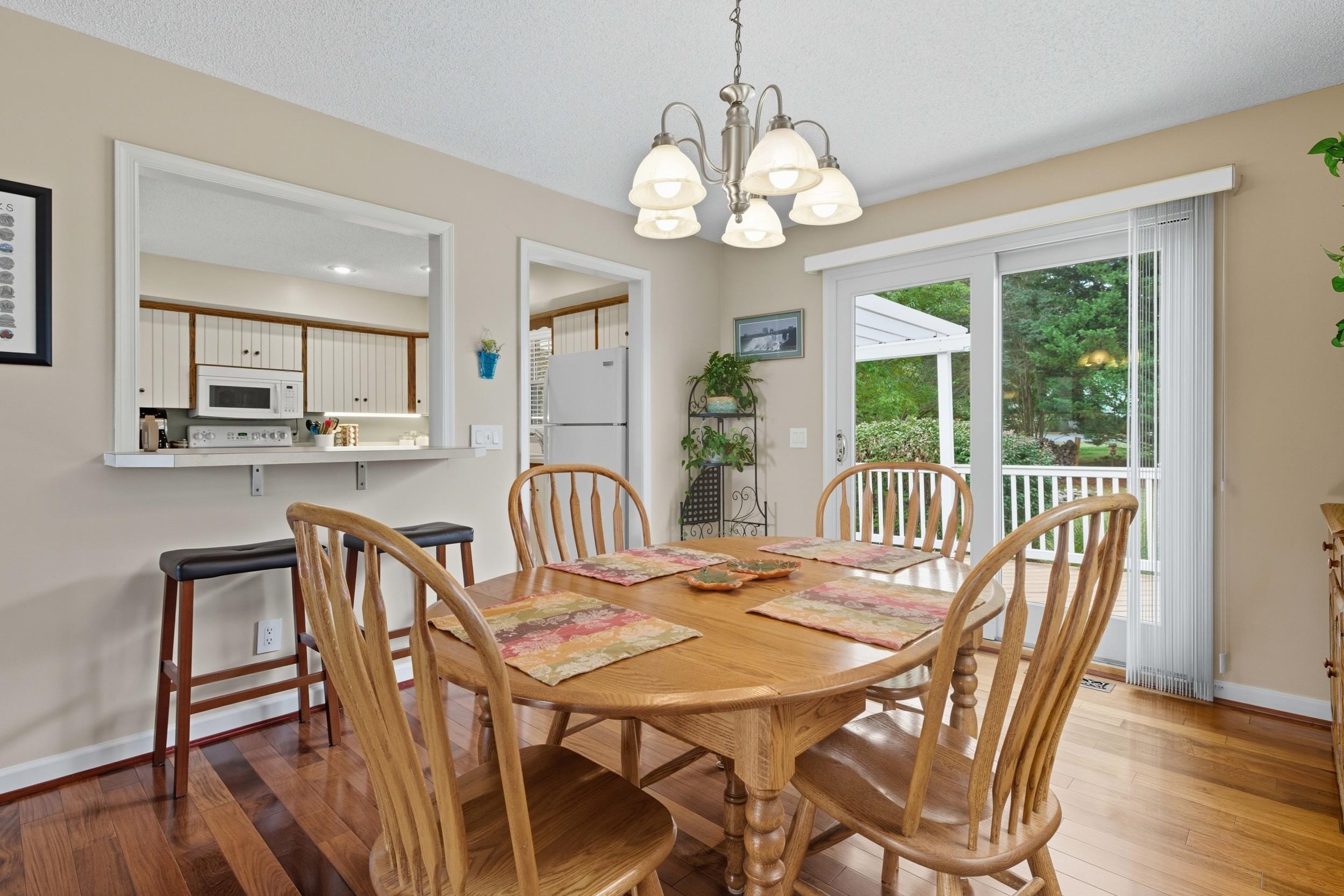 134 Rorrer Circle Harrisonburg, VA 22801 - Photo 9 of 74 a view of a dining room with furniture a chandelier and wooden floor