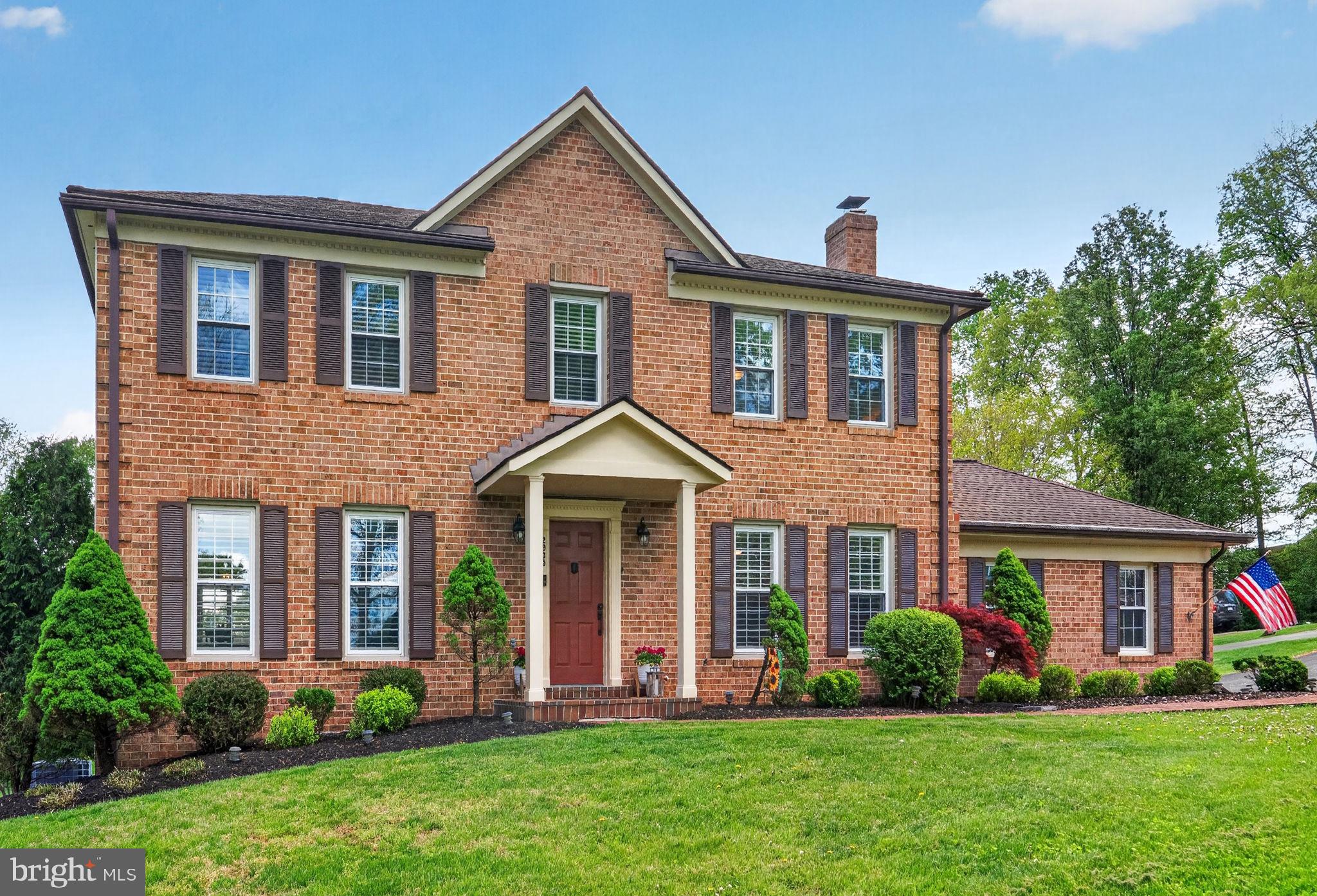 2935 Miller Heights Road Oakton, VA 22124 - Photo 2 of 56 Charming brick home with lush greenery.
