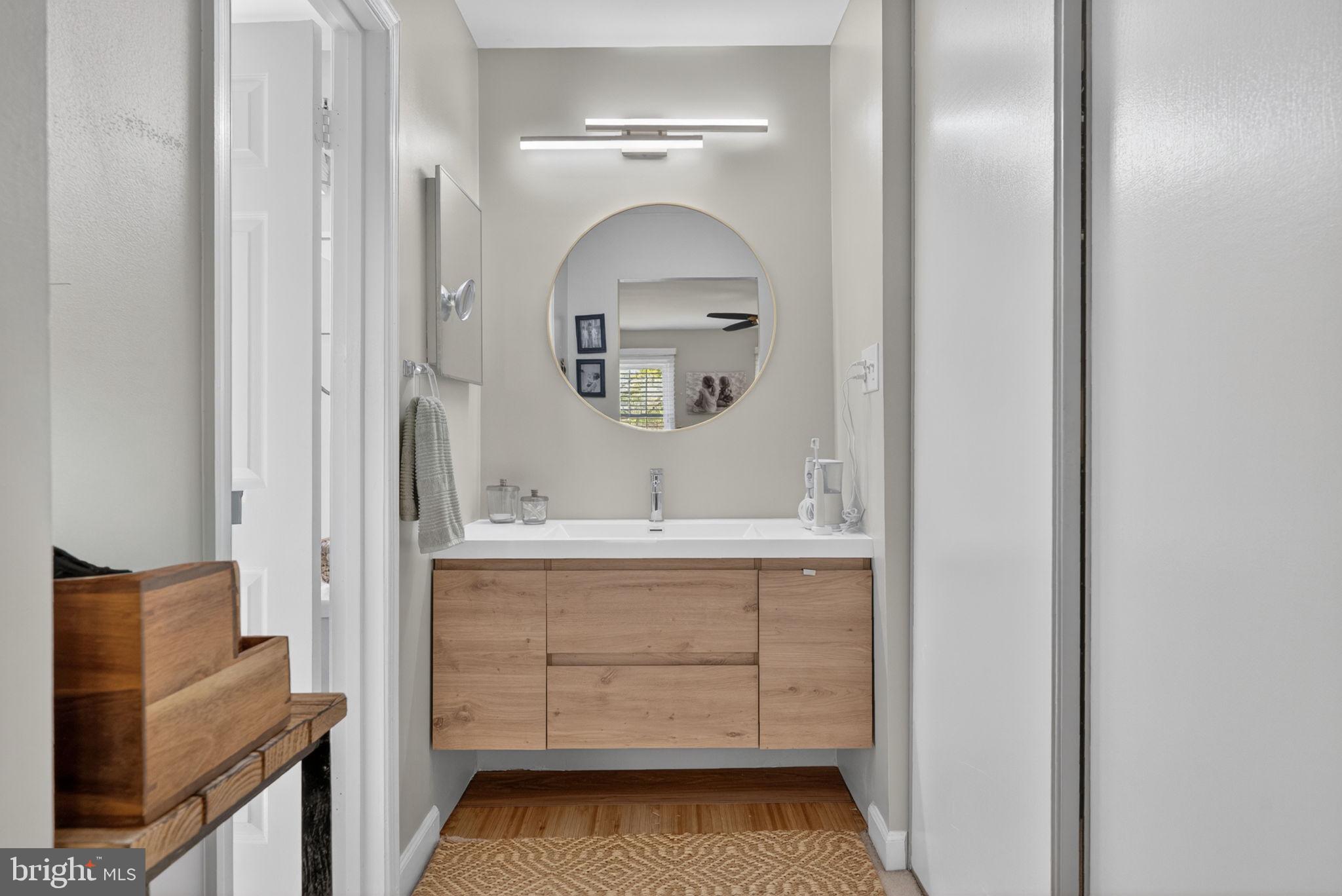 2935 Miller Heights Road Oakton, VA 22124 - Photo 25 of 56 Sleek modern bathroom with natural tones.