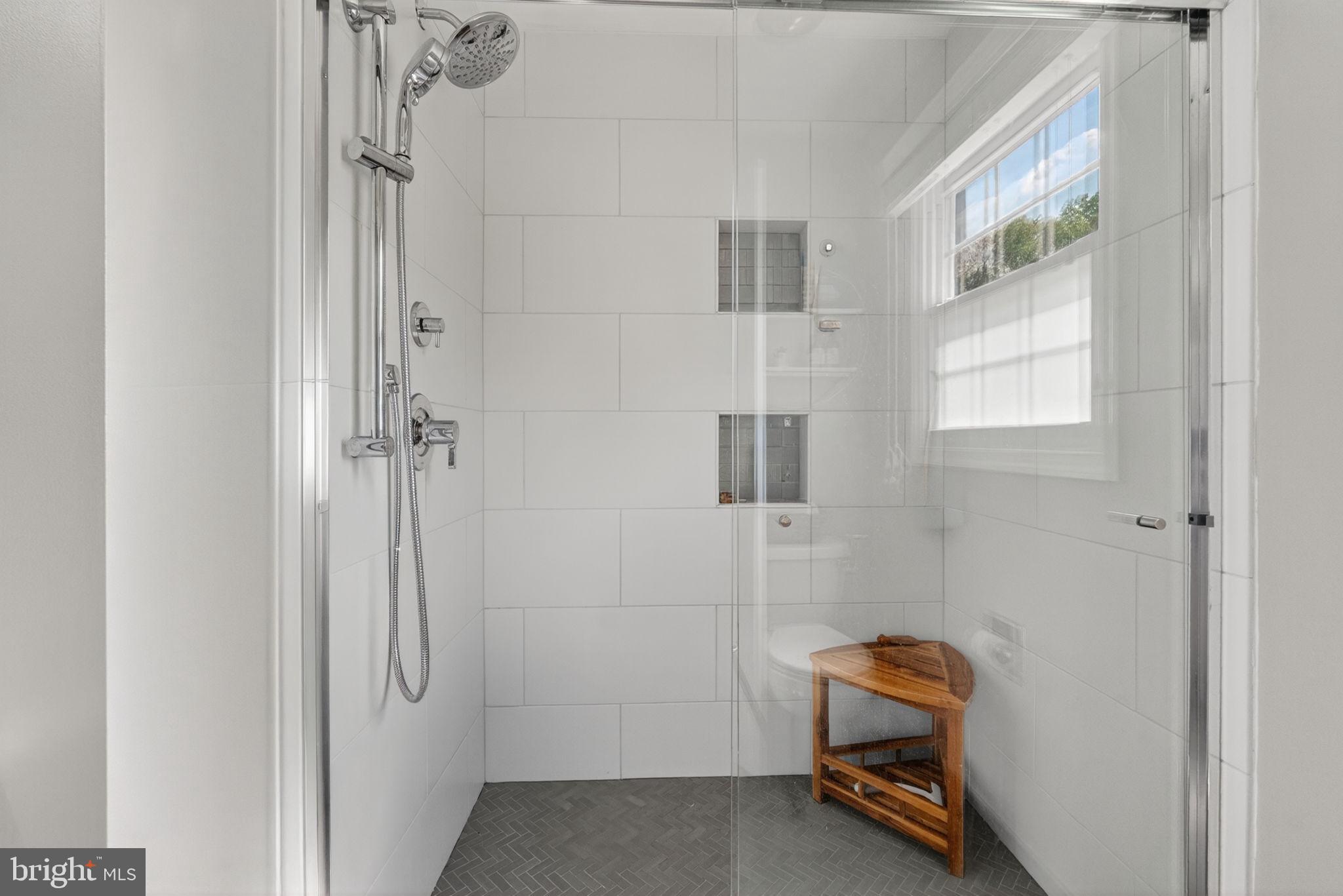 2935 Miller Heights Road Oakton, VA 22124 - Photo 27 of 56 Sleek modern shower with natural light.