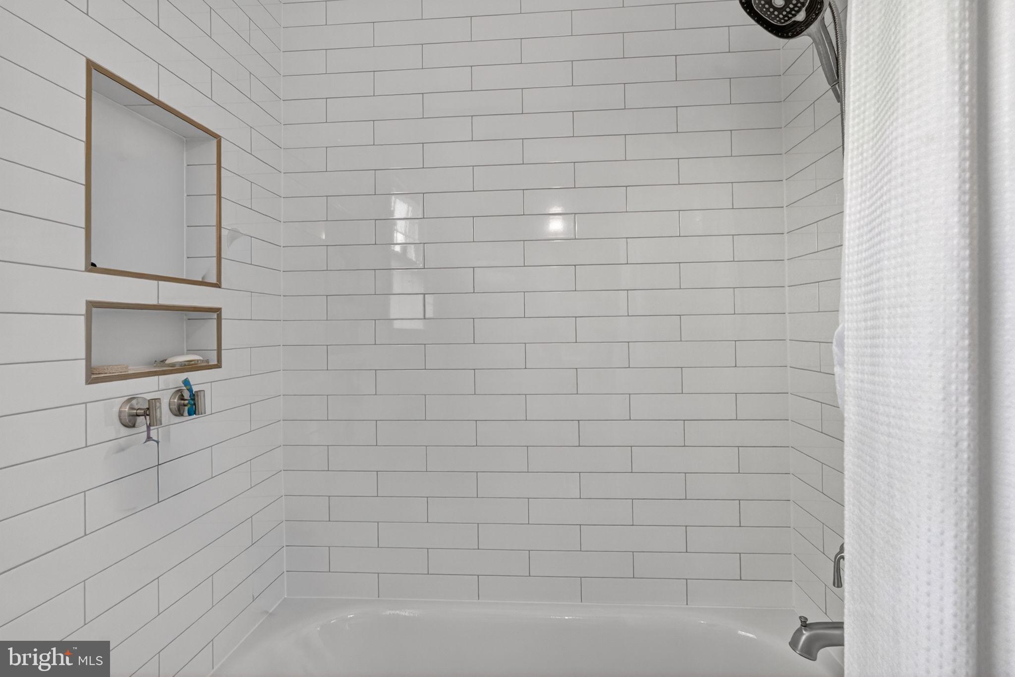 2935 Miller Heights Road Oakton, VA 22124 - Photo 31 of 56 Sleek, modern shower with clean lines.