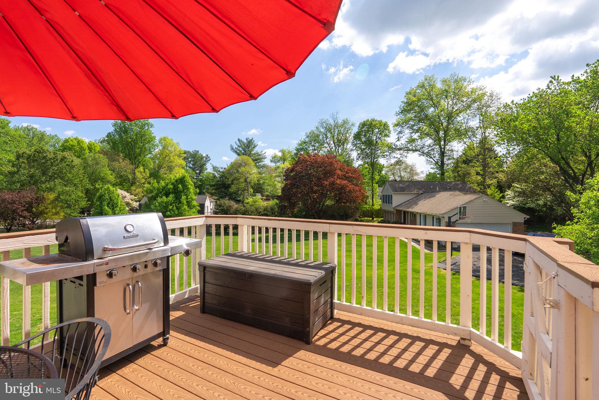 2935 Miller Heights Road Oakton, VA 22124 - Photo 44 of 56 Sunny deck with vibrant red umbrella.