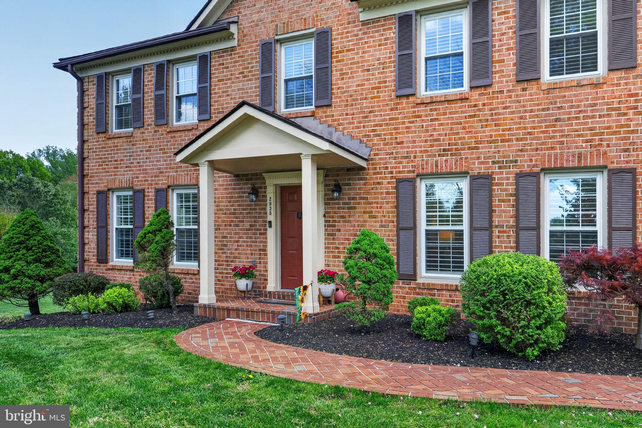 2935 Miller Heights Road Oakton, VA 22124 - Photo 51 of 56 Charming brick facade with lush greenery.