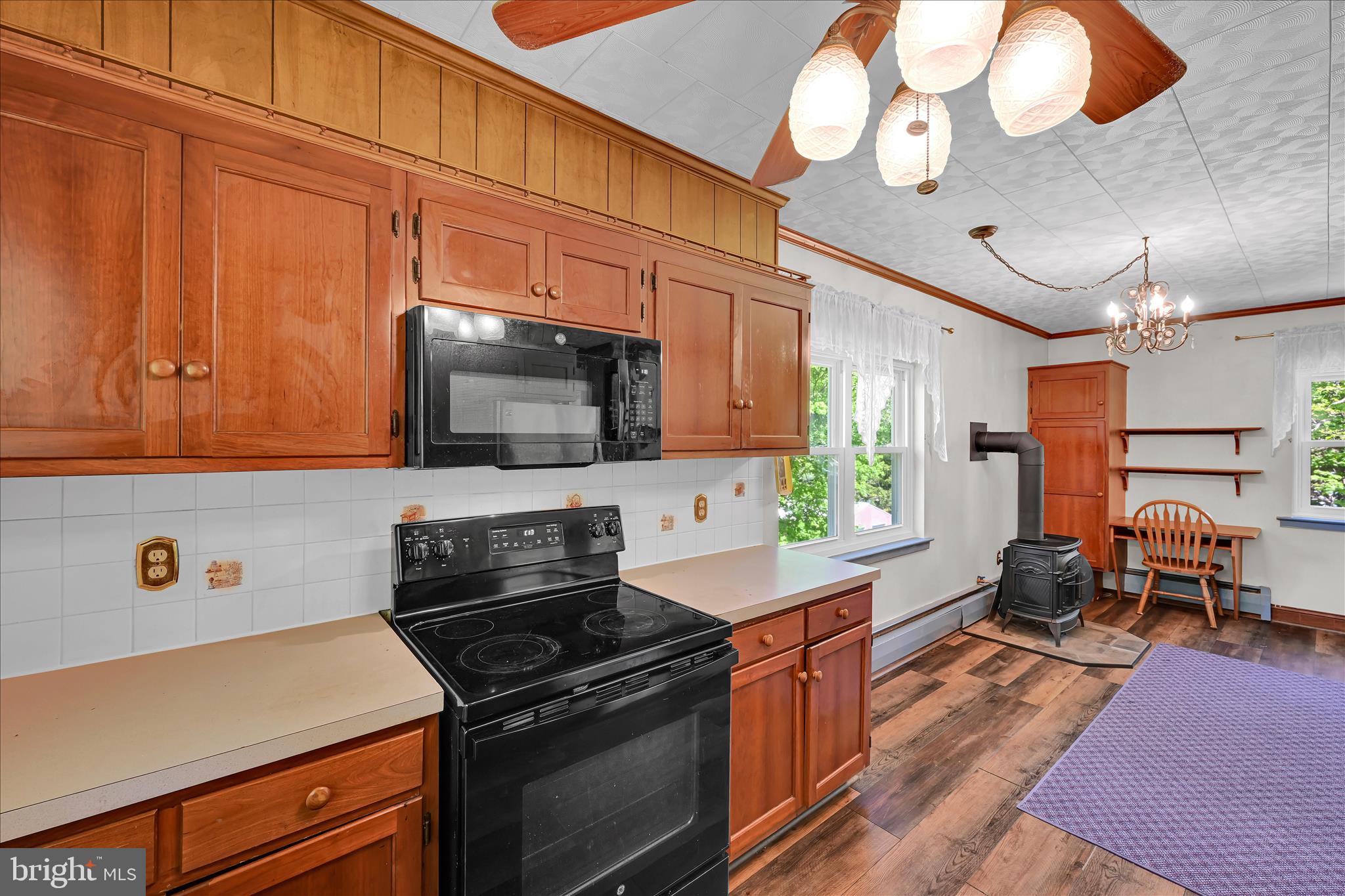 147 Walnut Street Mohnton, PA 19540 - Photo 12 of 46 a kitchen with stainless steel appliances a stove a microwave and cabinets
