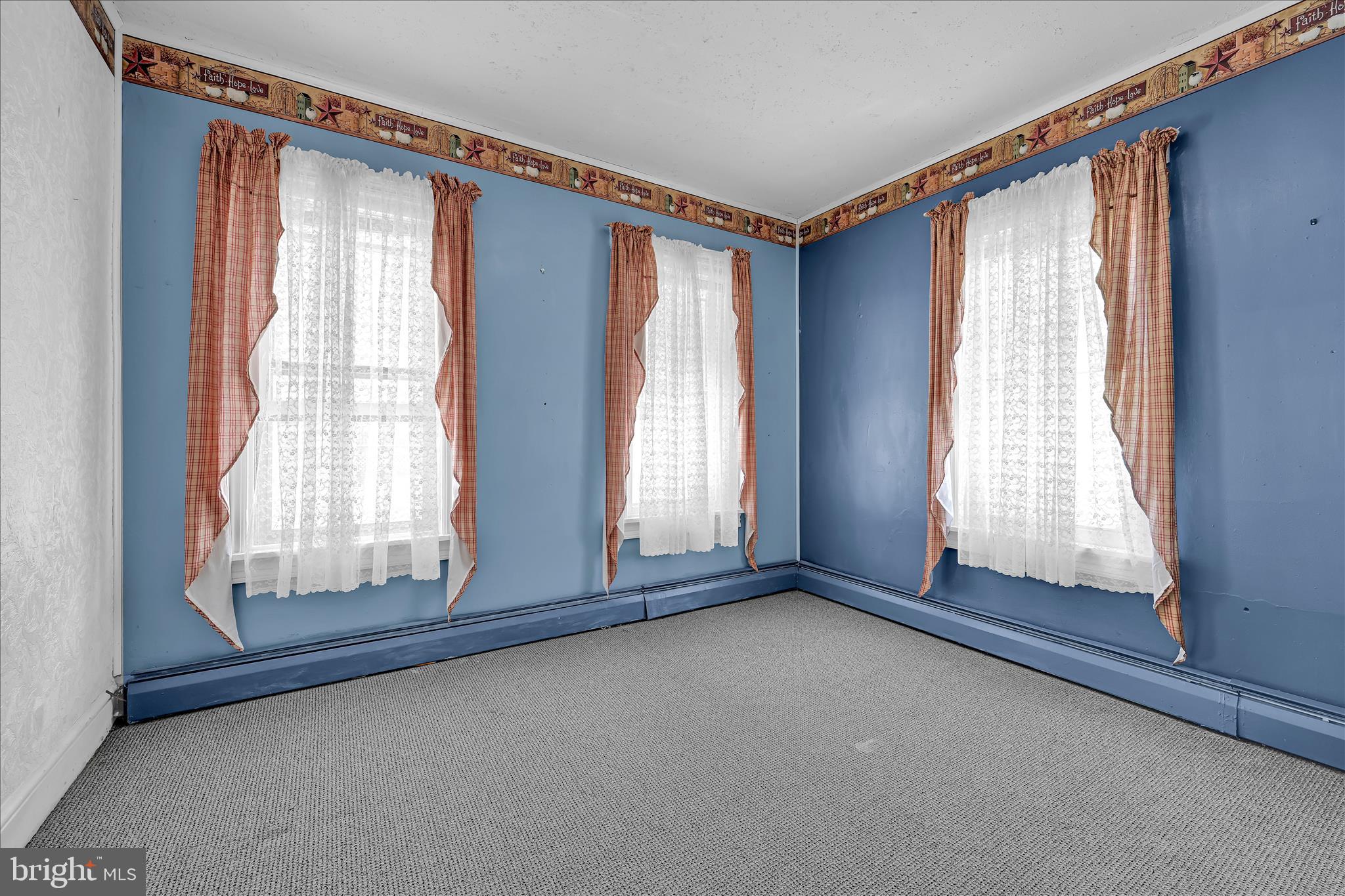 147 Walnut Street Mohnton, PA 19540 - Photo 18 of 46 a view of an empty room with wooden floor and a window