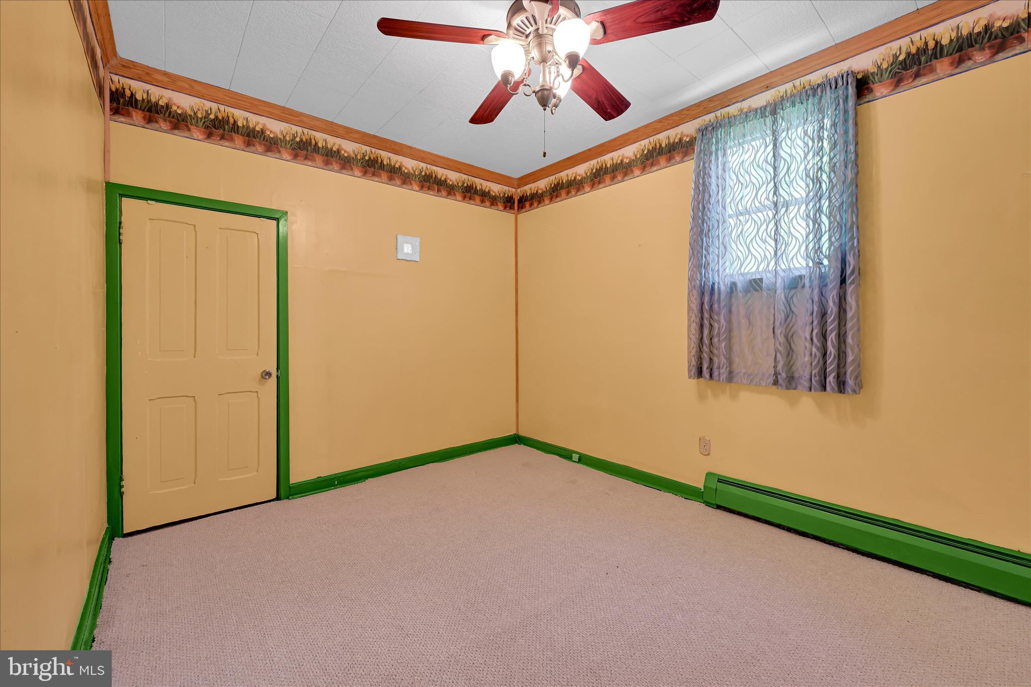 147 Walnut Street Mohnton, PA 19540 - Photo 31 of 46 a view of a room with a chandelier fan and a window