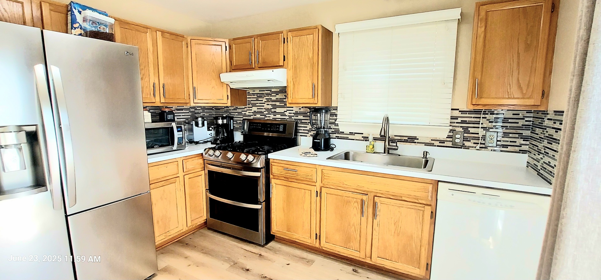 100 Hamlet Circle Montgomery, IL 60538 - Photo 12 of 42 a kitchen with stainless steel appliances a refrigerator sink and cabinets