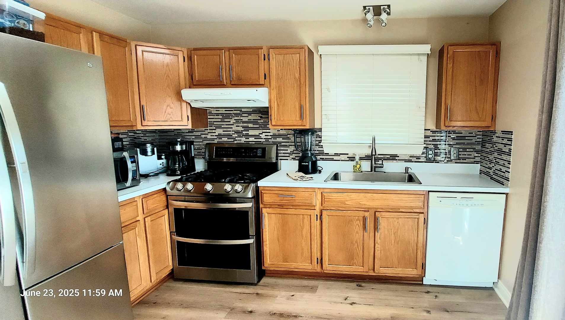 100 Hamlet Circle Montgomery, IL 60538 - Photo 14 of 42 a kitchen with a stove and a refrigerator