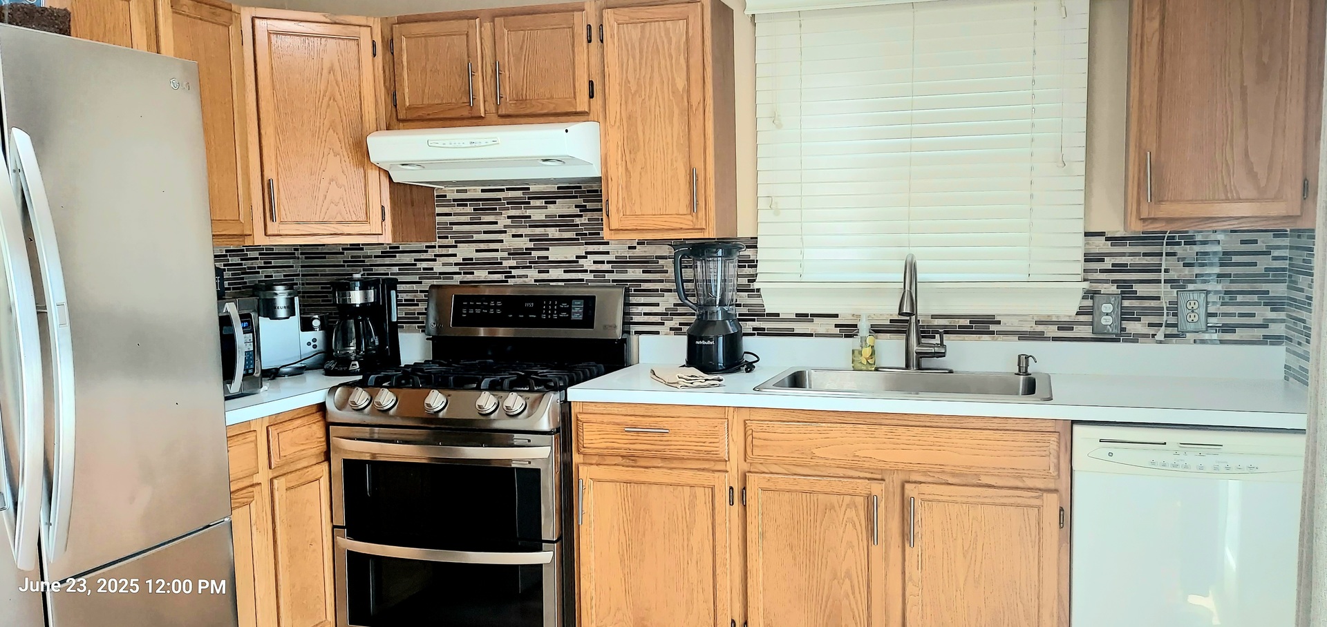 100 Hamlet Circle Montgomery, IL 60538 - Photo 15 of 42 a kitchen with stainless steel appliances granite countertop a stove and a refrigerator