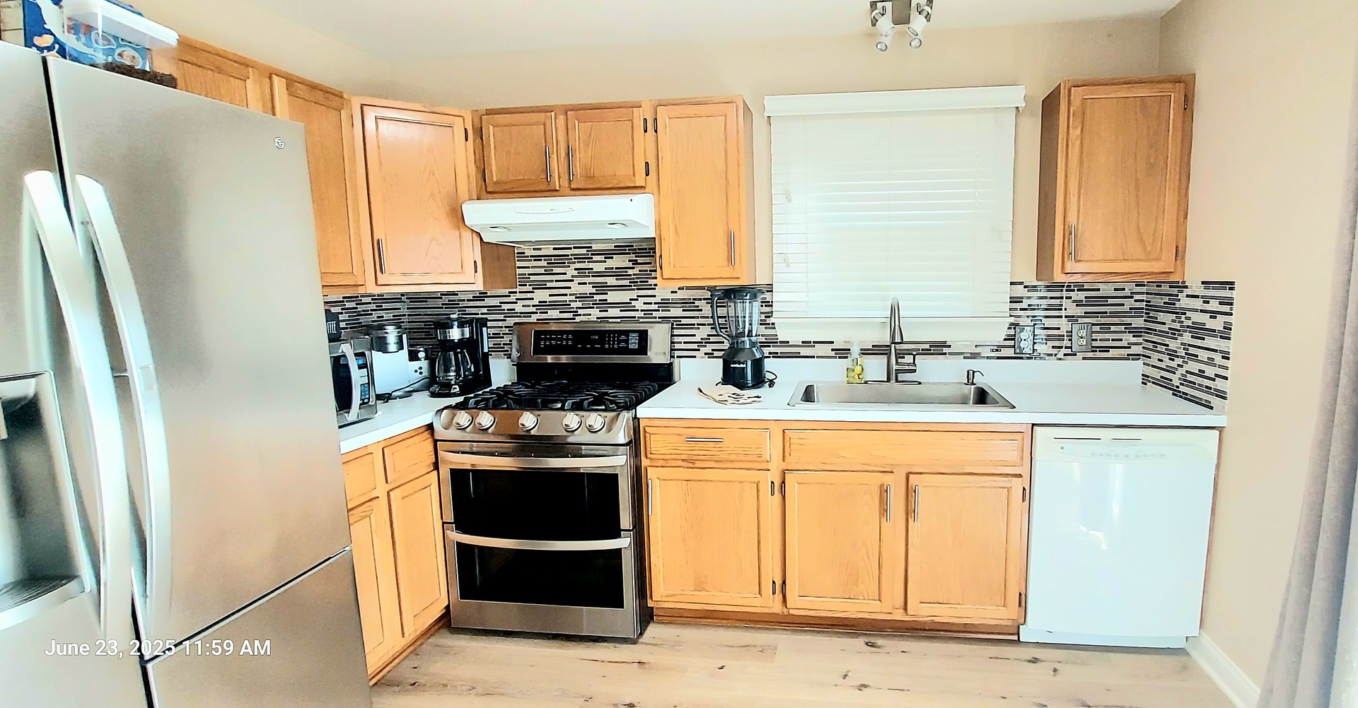 100 Hamlet Circle Montgomery, IL 60538 - Photo 16 of 42 a kitchen with stainless steel appliances a stove a refrigerator and a sink