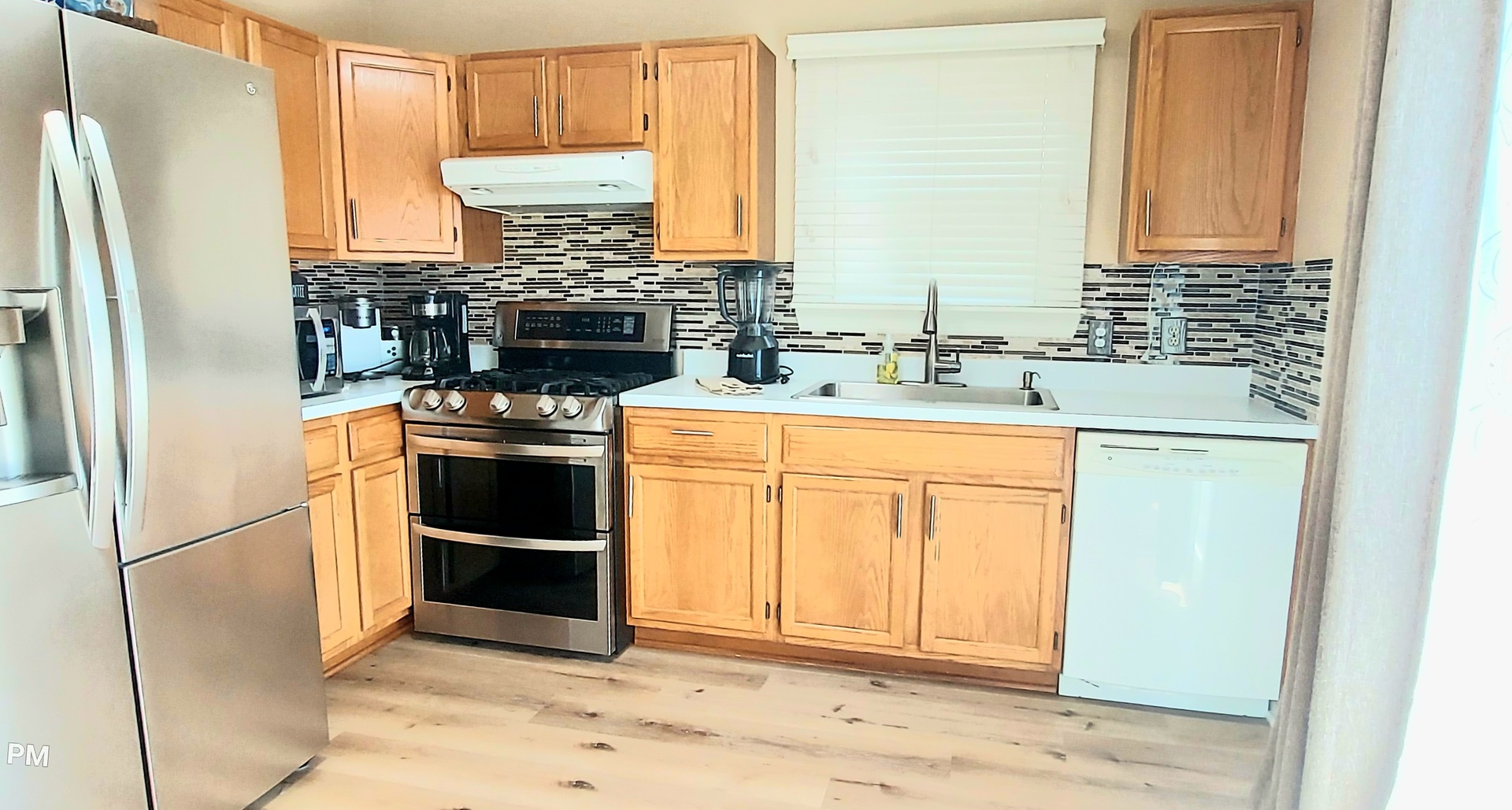 100 Hamlet Circle Montgomery, IL 60538 - Photo 17 of 42 a kitchen with appliances cabinets and a sink