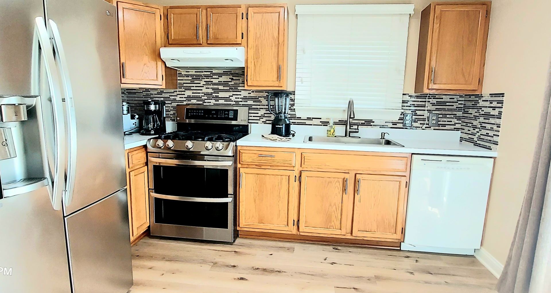 100 Hamlet Circle Montgomery, IL 60538 - Photo 18 of 42 a kitchen with appliances cabinets and a sink