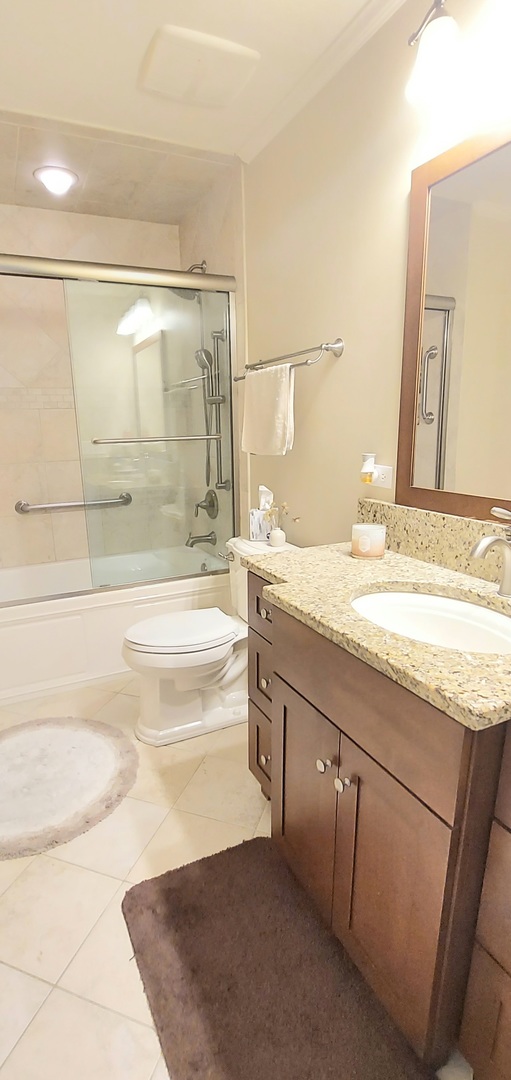 100 Hamlet Circle Montgomery, IL 60538 - Photo 35 of 42 a bathroom with a granite countertop sink a toilet and bathtub