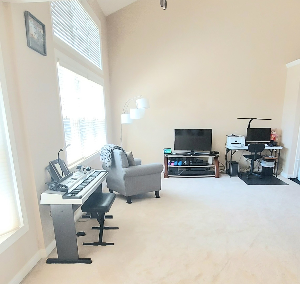 100 Hamlet Circle Montgomery, IL 60538 - Photo 4 of 42 a living room with furniture and a flat screen tv