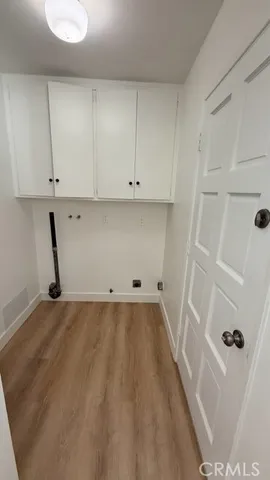a view of a storage and utility room with closet