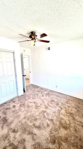 a view of a big room with carpet