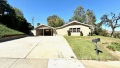 a front view of a building with garden