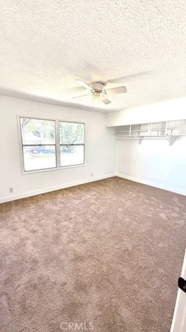 an empty room with an empty space and windows