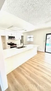 a bathroom with a sink a mirror and a vanity