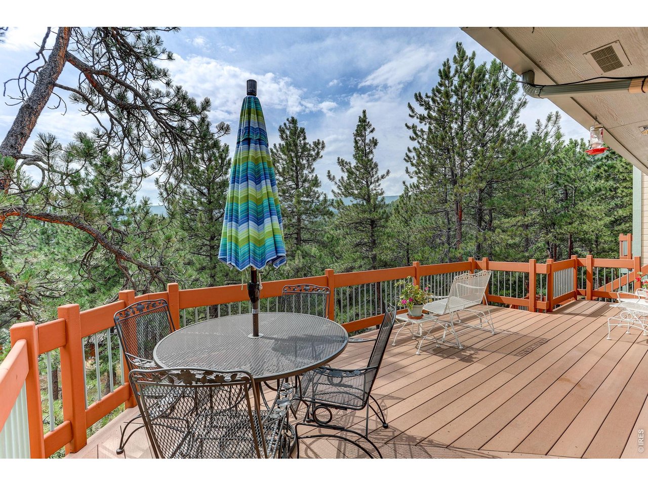 65 Betasso Road Boulder, CO 80302 - Photo 17 of 38 a balcony with wooden floor table and chairs