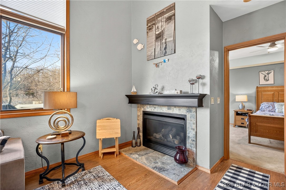 177 Ridgewood Drive Lake Ozark, MO 65049 - Photo 14 of 49 Fireplace in Living Room Looking to Primary Suite