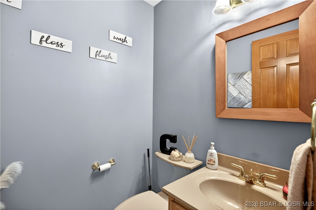 177 Ridgewood Drive Lake Ozark, MO 65049 - Photo 21 of 49 Half bath close to entry & laundry