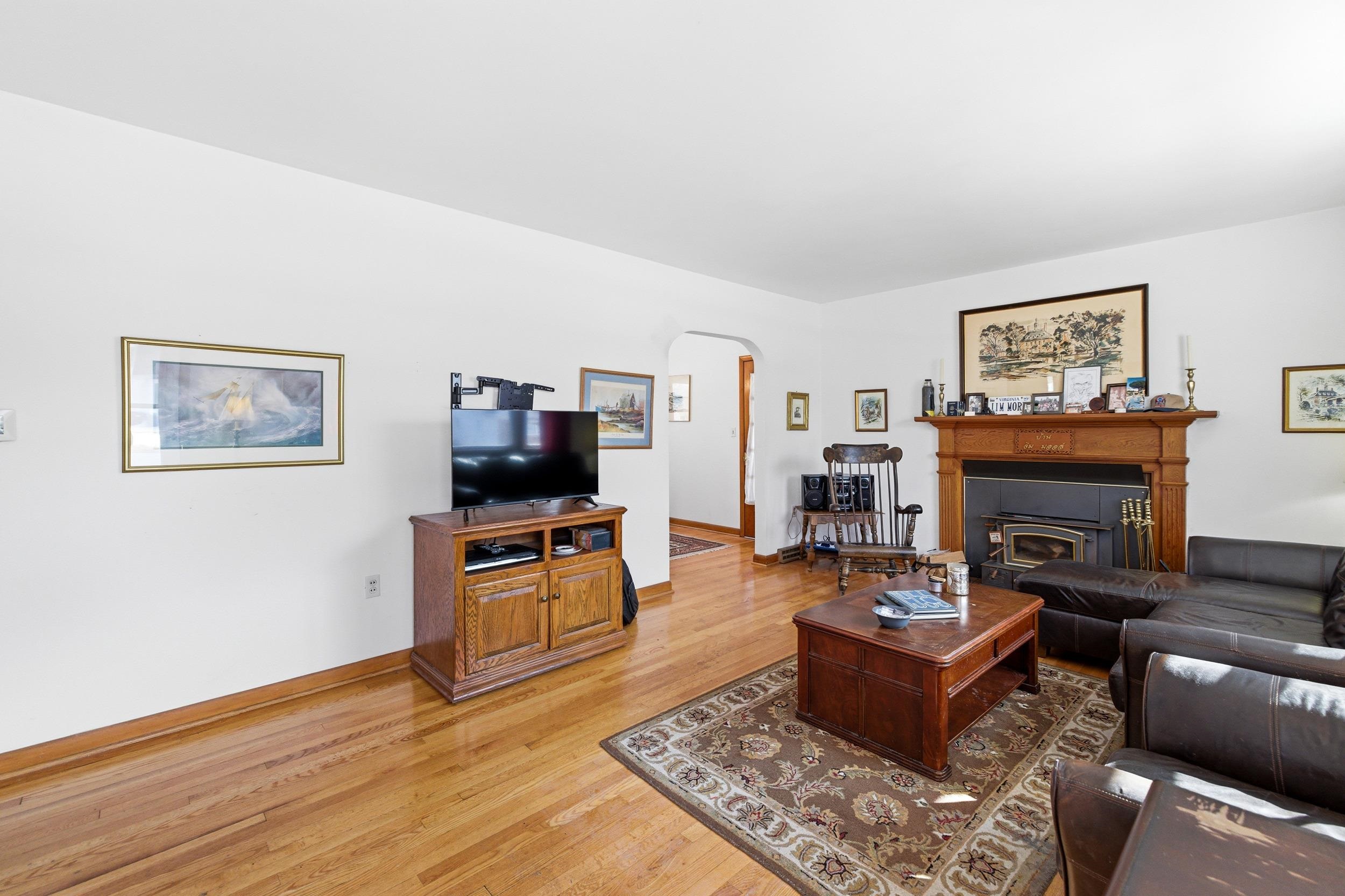 405 North River Road Bridgewater, VA 22812 - Photo 13 of 55 a living room with furniture a flat screen tv and a fireplace