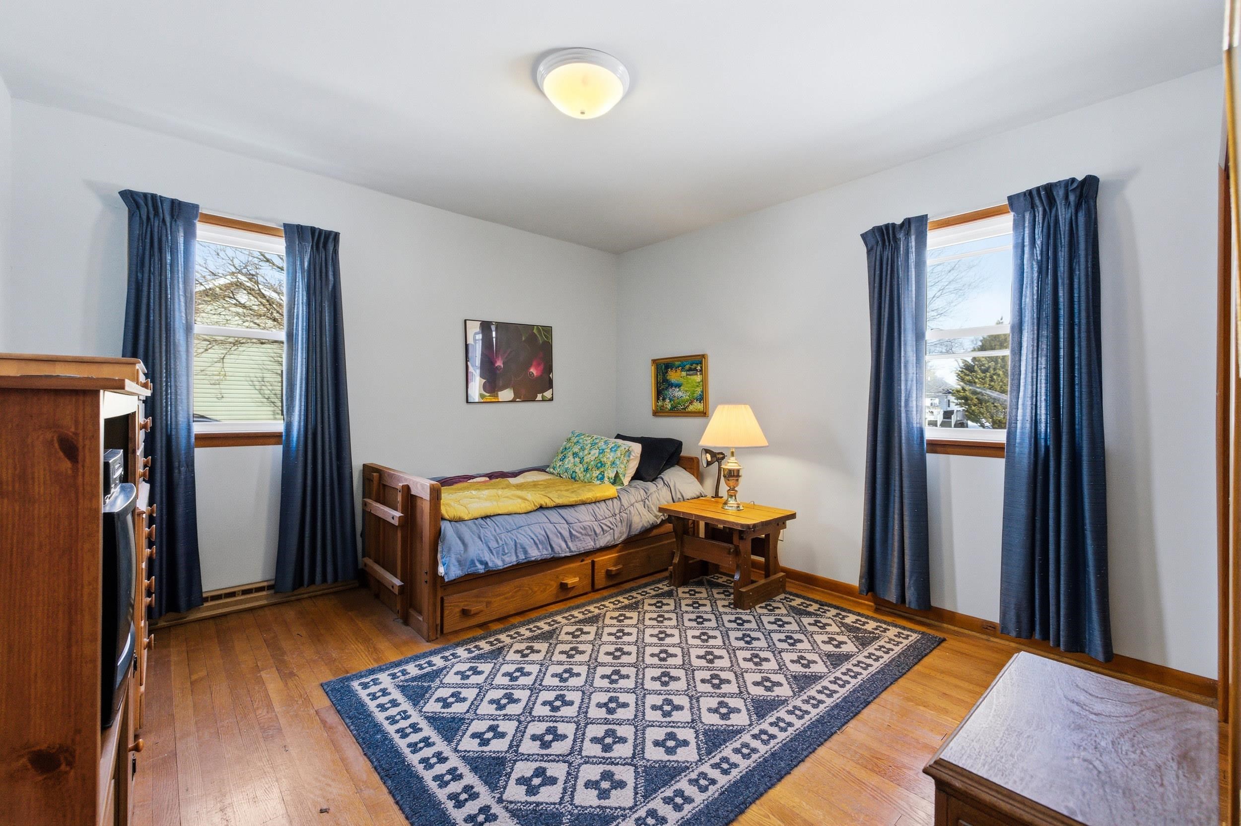 405 North River Road Bridgewater, VA 22812 - Photo 19 of 55 a bedroom with a bed and wooden floor