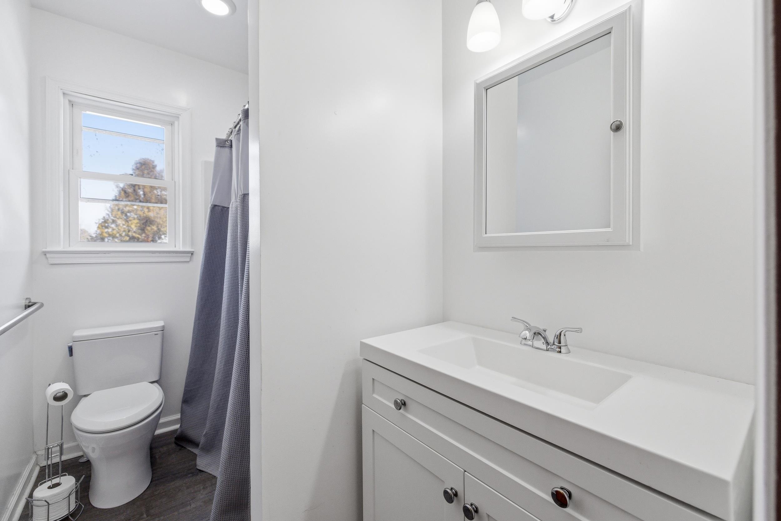 405 North River Road Bridgewater, VA 22812 - Photo 24 of 55 a bathroom with a sink a toilet and a mirror