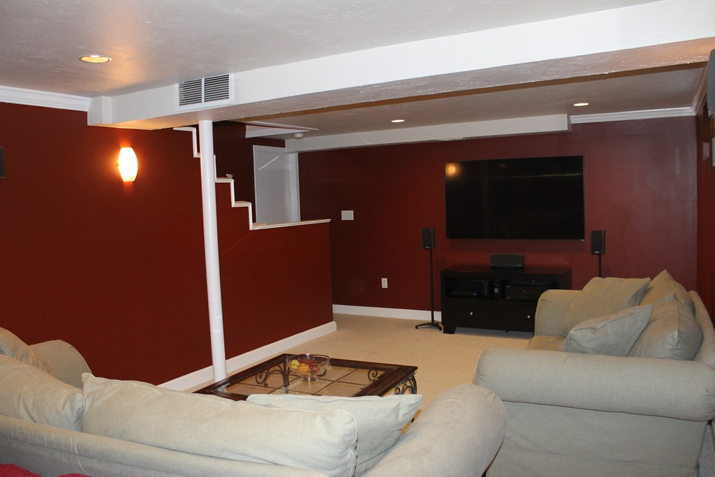 67 Colasanti Road Weymouth, MA 02191 - Photo 16 of 16 a living room with furniture and a flat screen tv
