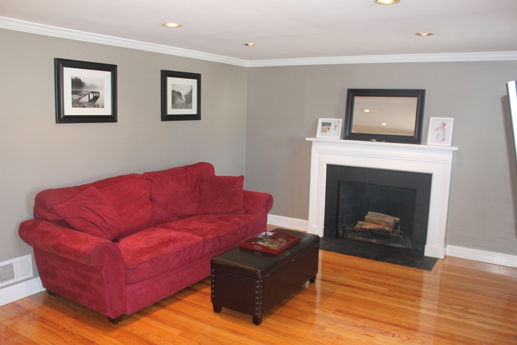 67 Colasanti Road Weymouth, MA 02191 - Photo 7 of 16 a living room with furniture or wooden floor and a fireplace